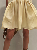Yellow Sleeveless Mini Dress with Deep V-Neck and Lace Trim