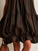 Brown sleeveless mini dress with a bubble hem